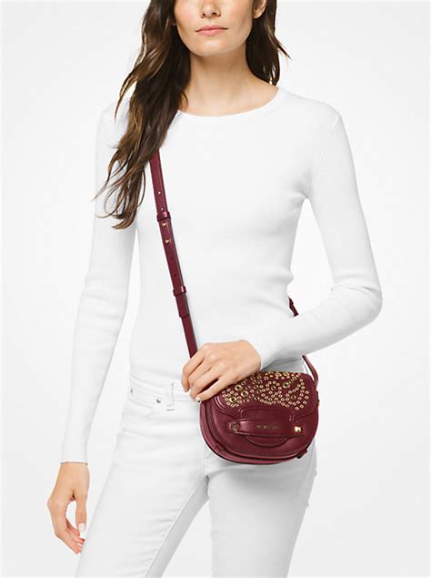 michael kors cary small saddle crossbody|Cary Small Grommeted Leather Saddle Bag .